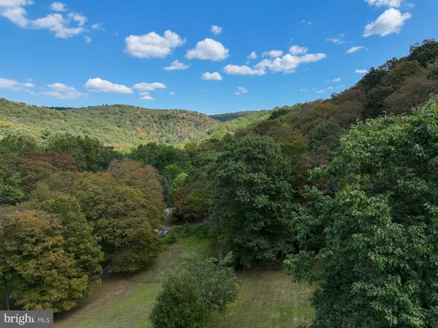 a bathroom with a toilet a sink and a window