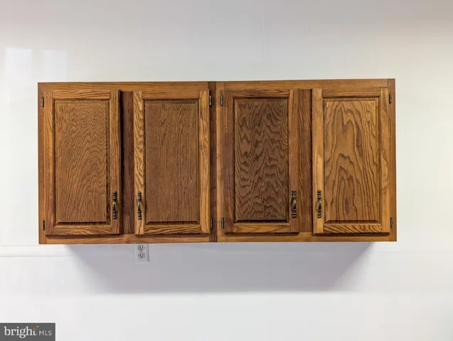 a view of staircase with a rug and a window