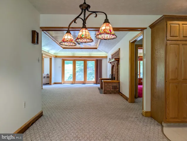 a view of a big yard with lots of green space