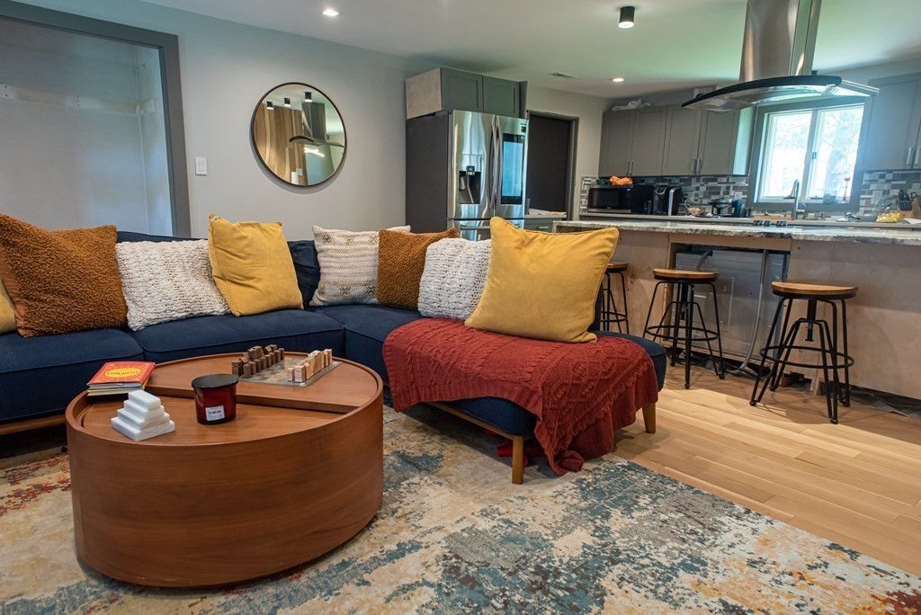 a living room with furniture and a table