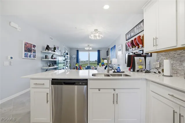a kitchen with cabinets a sink and appliances