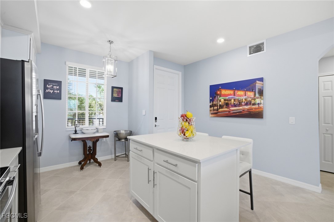 43993 Boardwalk Loop, Unit 1925 Punta Gorda, FL 33982 - Photo 12 of 35 a view of kitchen with stainless steel appliances granite countertop sink stove and refrigerator