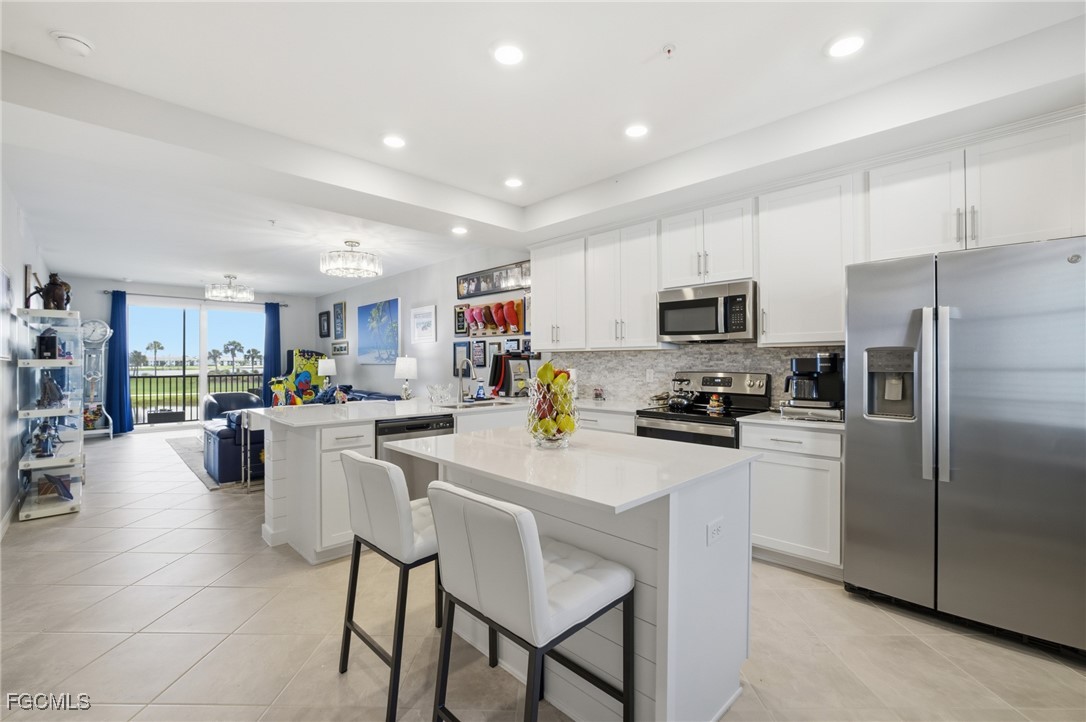 43993 Boardwalk Loop, Unit 1925 Punta Gorda, FL 33982 - Photo 14 of 35 a kitchen with counter space cabinets and stainless steel appliances