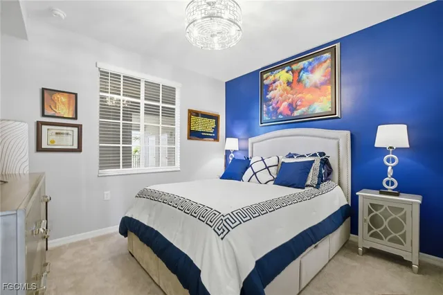 a bedroom with double bed and a window