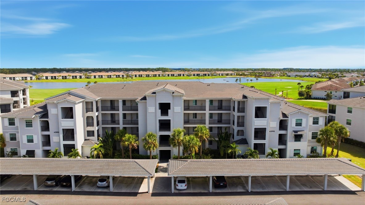 43993 Boardwalk Loop, Unit 1925 Punta Gorda, FL 33982 - Photo 2 of 35 a view of multiple houses with a yard