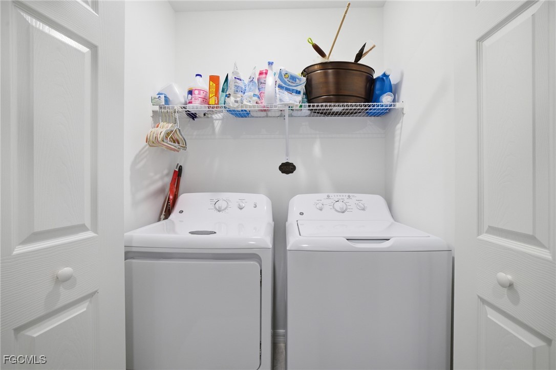 43993 Boardwalk Loop, Unit 1925 Punta Gorda, FL 33982 - Photo 25 of 35 a utility room with dryer and washer