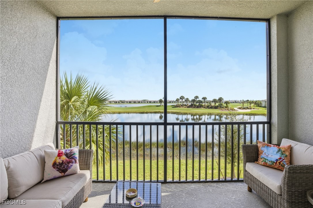43993 Boardwalk Loop, Unit 1925 Punta Gorda, FL 33982 - Photo 32 of 35 a view of a porch with furniture and floor to ceiling window
