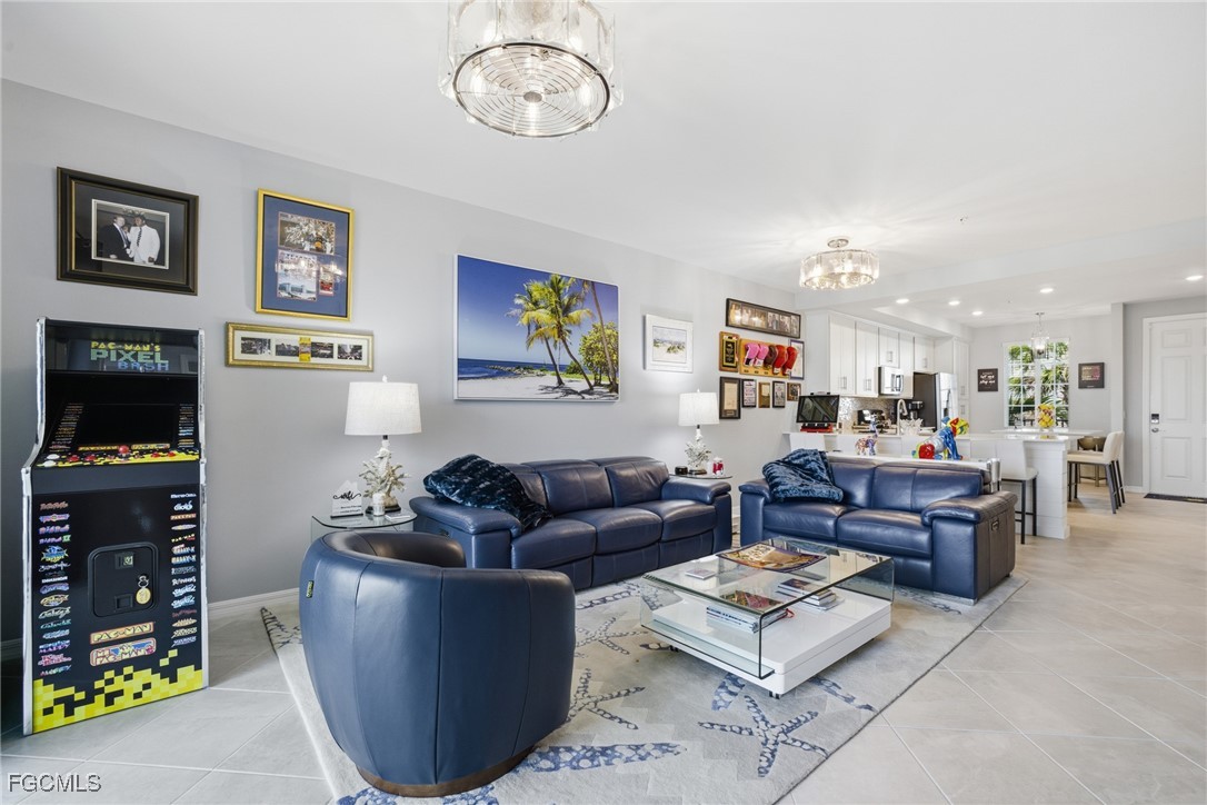 43993 Boardwalk Loop, Unit 1925 Punta Gorda, FL 33982 - Photo 5 of 35 a living room with furniture and a flat screen tv