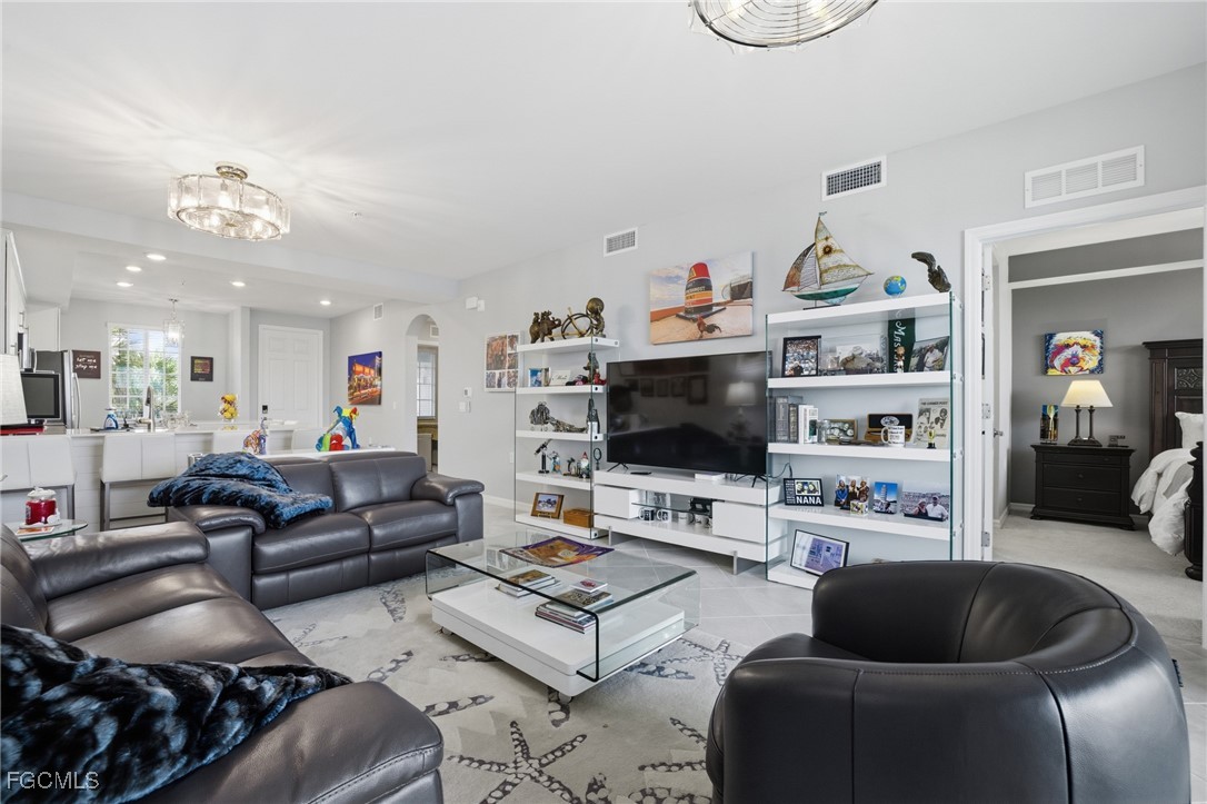 43993 Boardwalk Loop, Unit 1925 Punta Gorda, FL 33982 - Photo 7 of 35 a living room with furniture and a flat screen tv