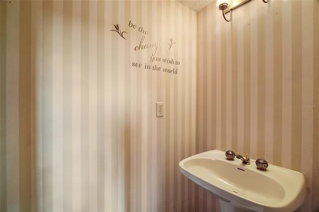 a kitchen with stainless steel appliances granite countertop a refrigerator and a stove