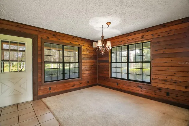 a kitchen with a sink and wooden cabinets