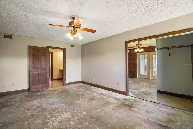 a bathroom with a granite countertop sink vanity and mirror