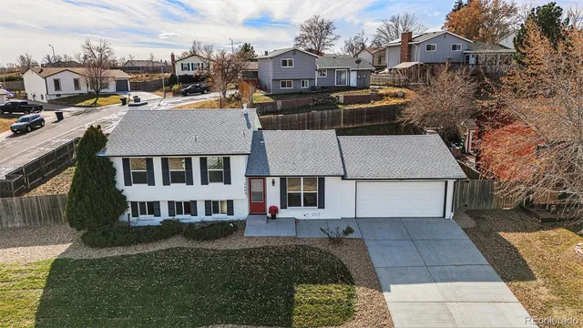 a aerial view of a house with a yard