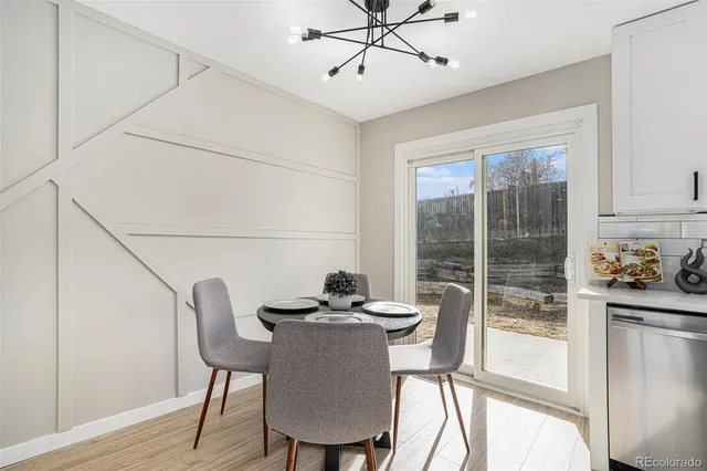 a dining room with furniture and window