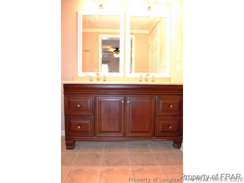 105 Beard Road Raeford, NC 28376 - Photo 17 of 29 a bathroom with a sink and a mirror