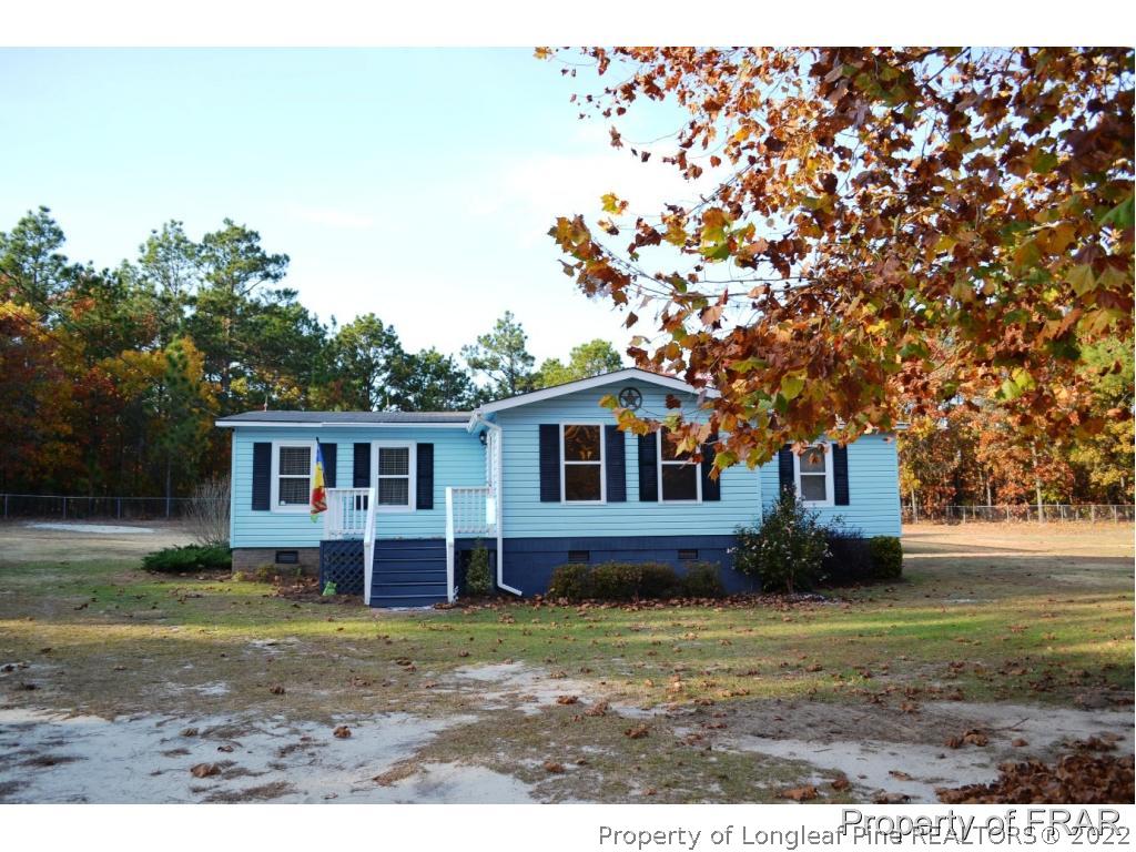 105 Beard Road Raeford, NC 28376 - Photo 2 of 29 a front view of a house with garden