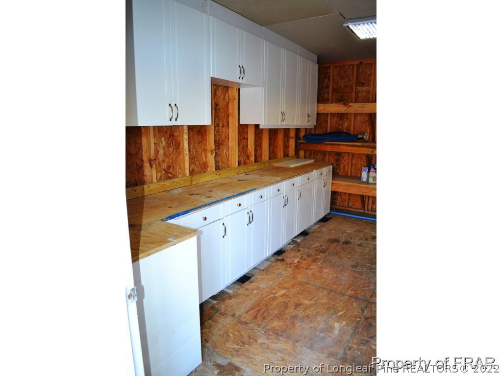 105 Beard Road Raeford, NC 28376 - Photo 29 of 29 a kitchen with granite countertop a sink and cabinets