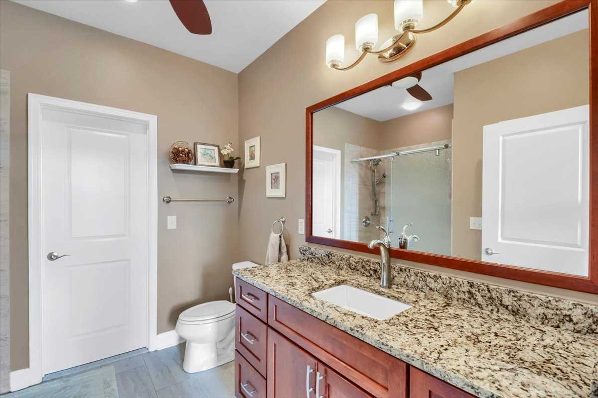 35 Farmington Road Wappinger, NY 12590 - Photo 12 of 28 a bathroom with a granite countertop sink and a mirror