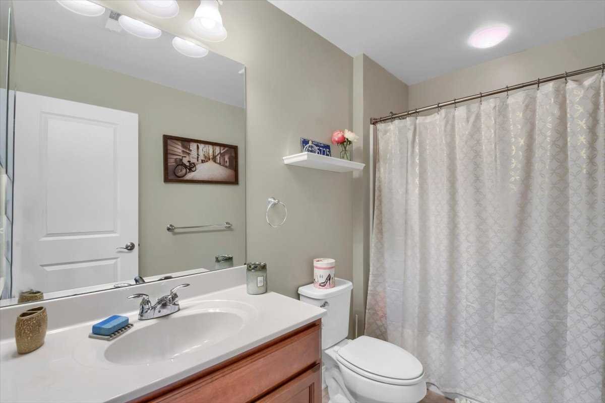 35 Farmington Road Wappinger, NY 12590 - Photo 15 of 28 a bathroom with a sink a toilet and shower curtain