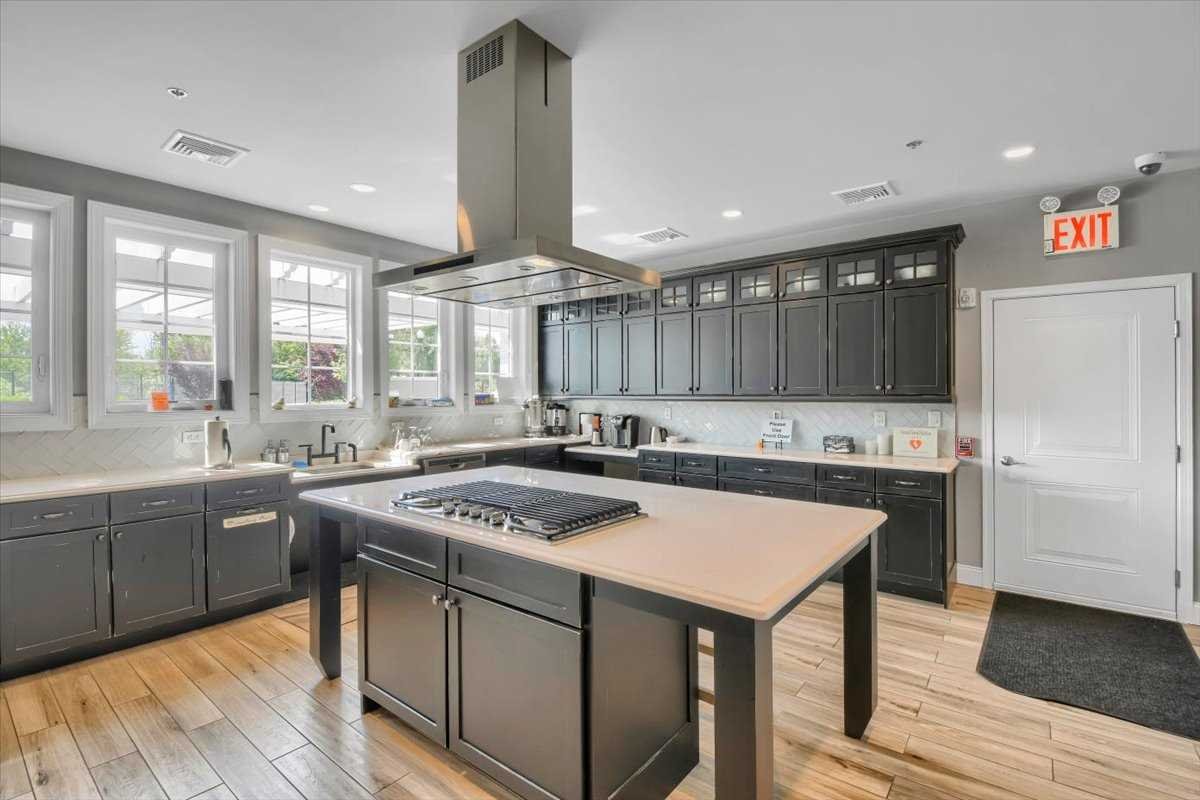 35 Farmington Road Wappinger, NY 12590 - Photo 23 of 28 a kitchen with a stove sink and cabinets