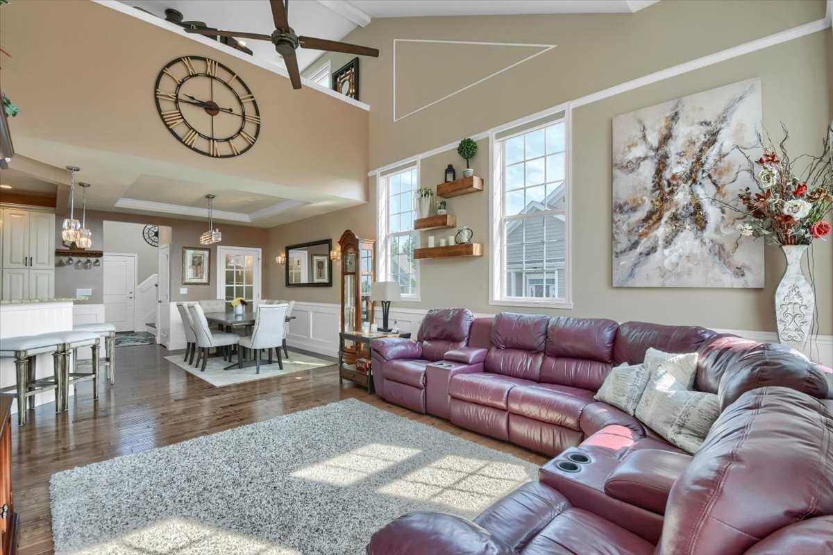 35 Farmington Road Wappinger, NY 12590 - Photo 5 of 28 a living room with furniture a clock on wall and a window