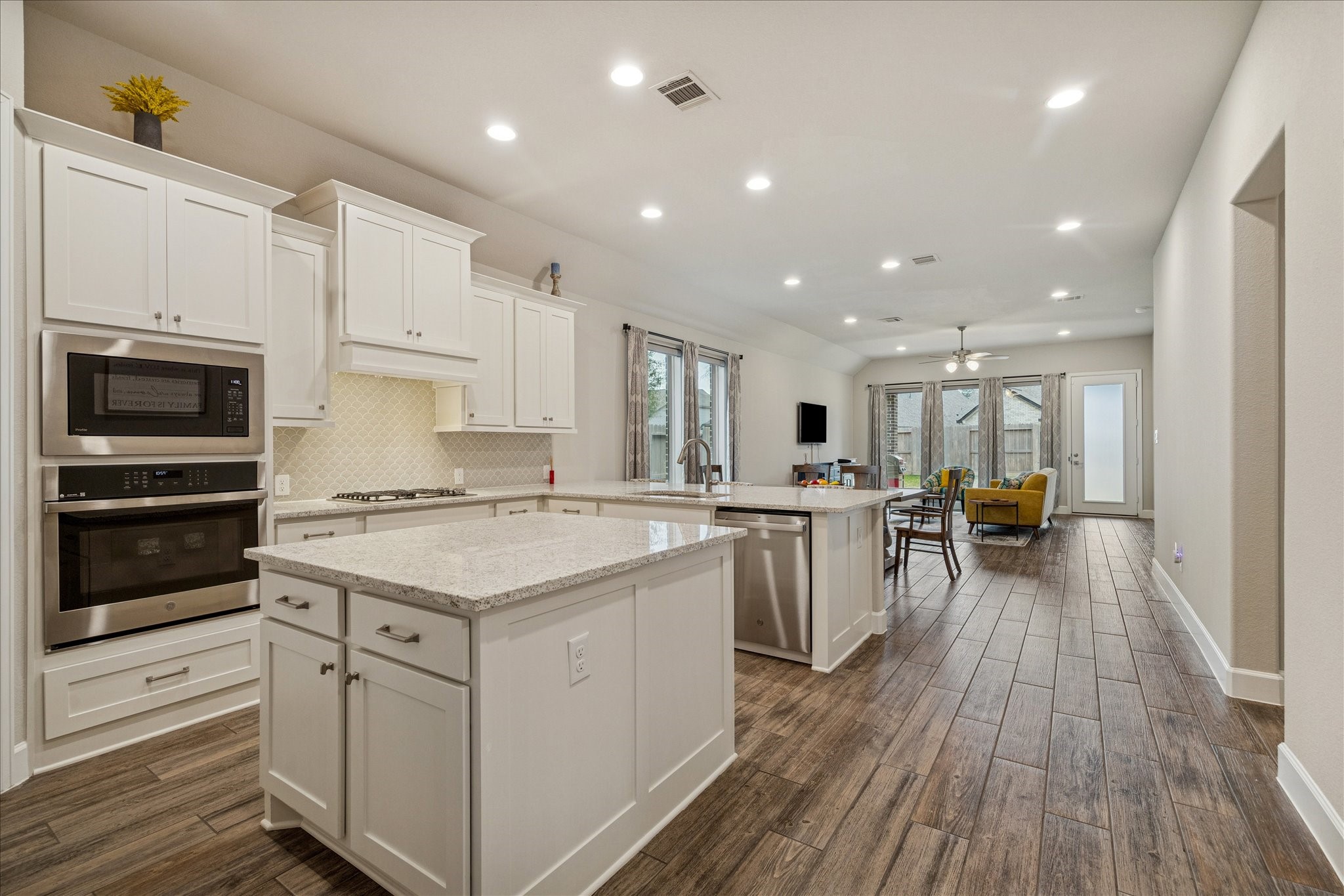 7354 Mount Greylock Loop Porter, TX 77365 - Photo 11 of 18 a kitchen with a sink stove and cabinets
