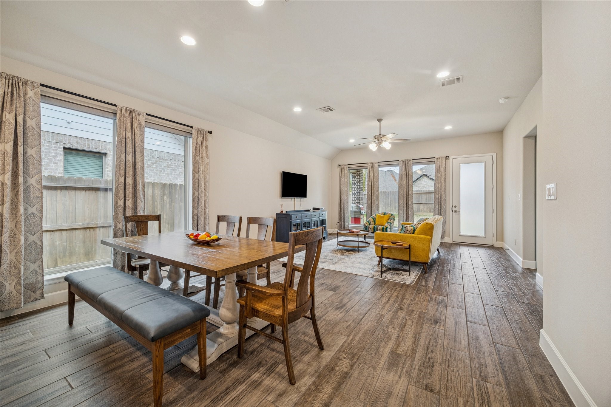 7354 Mount Greylock Loop Porter, TX 77365 - Photo 12 of 18 a view of a dining room with furniture window and wooden floor