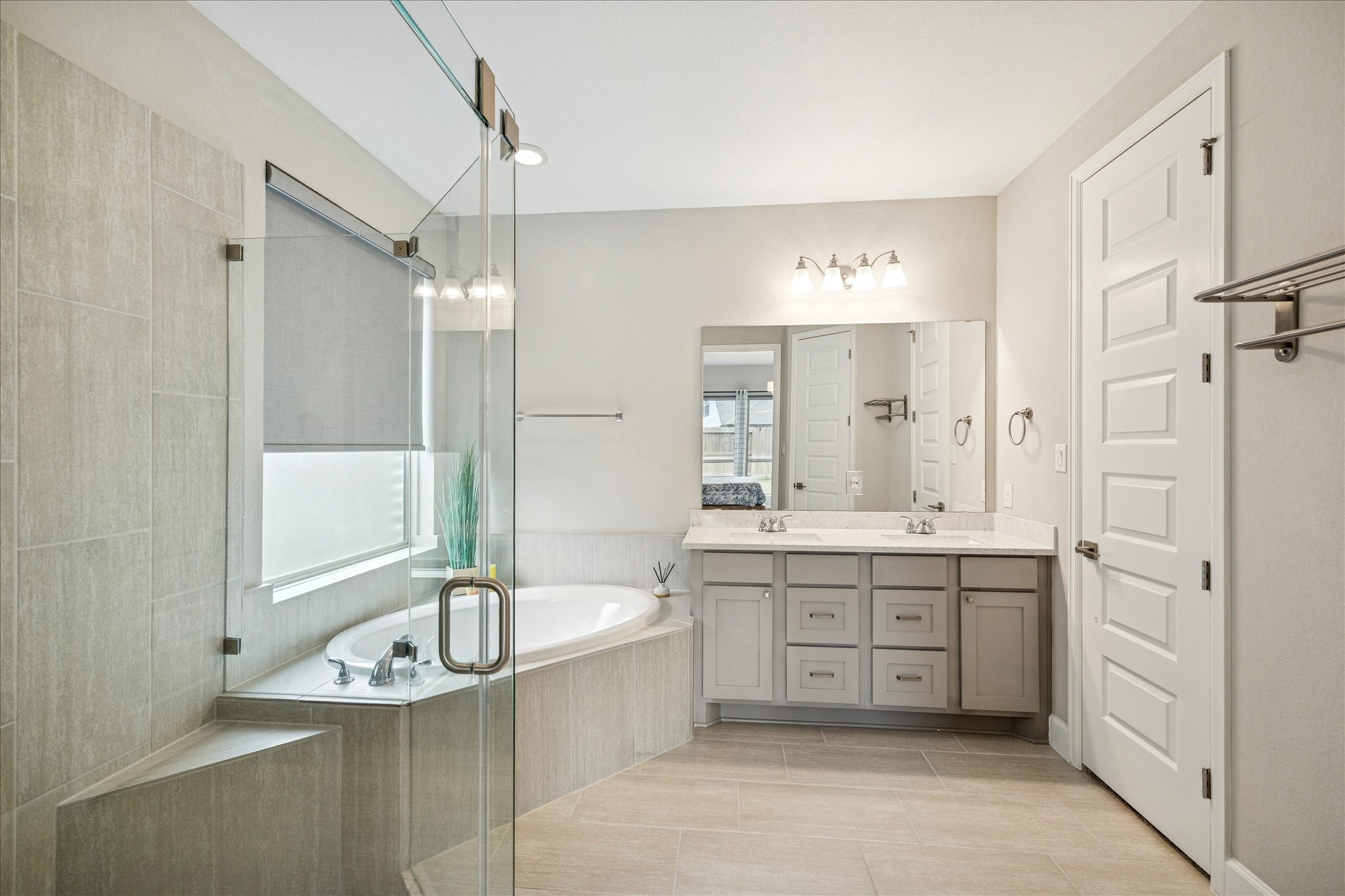 7354 Mount Greylock Loop Porter, TX 77365 - Photo 14 of 18 a bathroom with a granite countertop tub sink shower and mirror