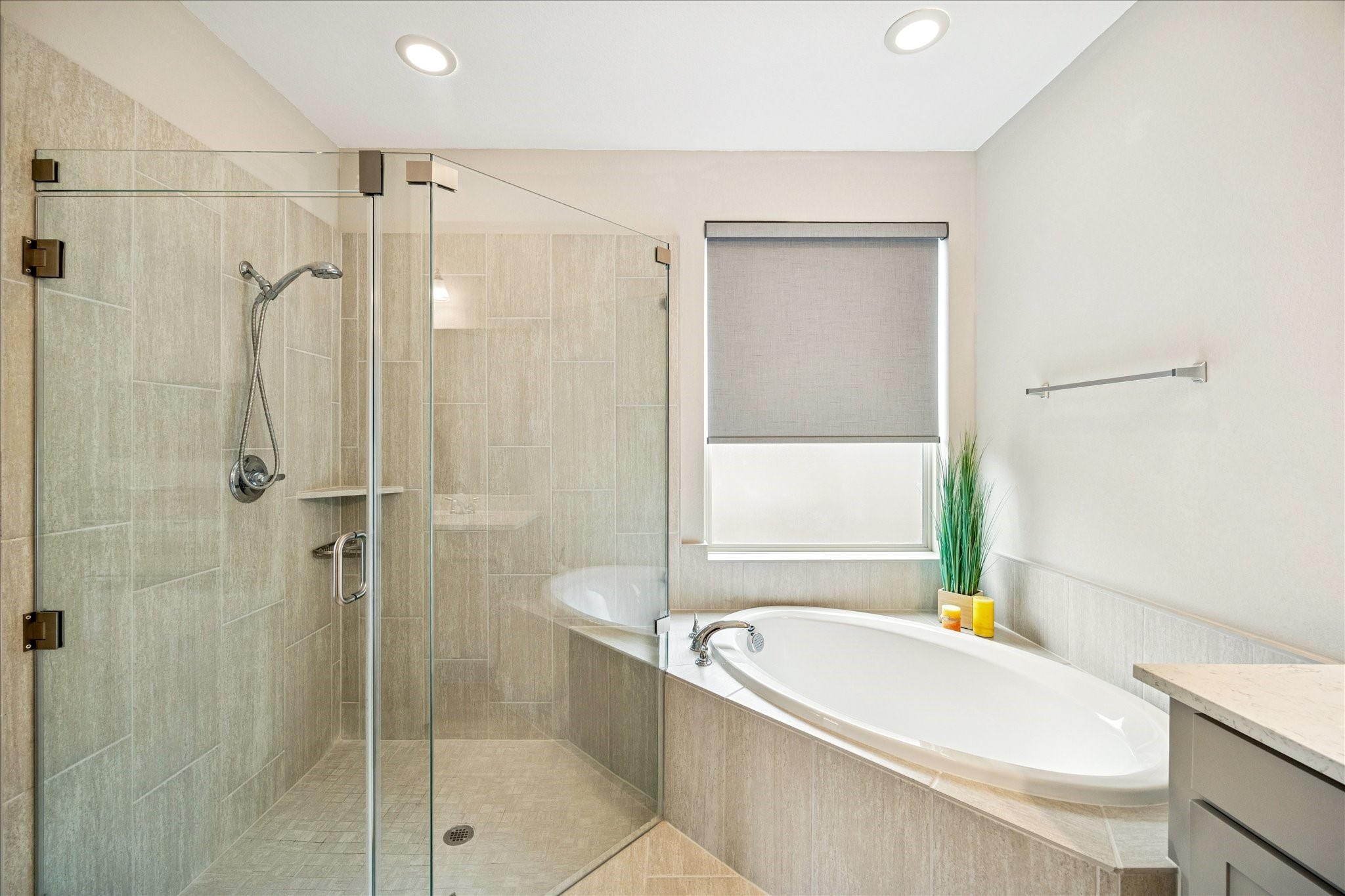 7354 Mount Greylock Loop Porter, TX 77365 - Photo 15 of 18 a bathroom with a tub a sink a window and a shower