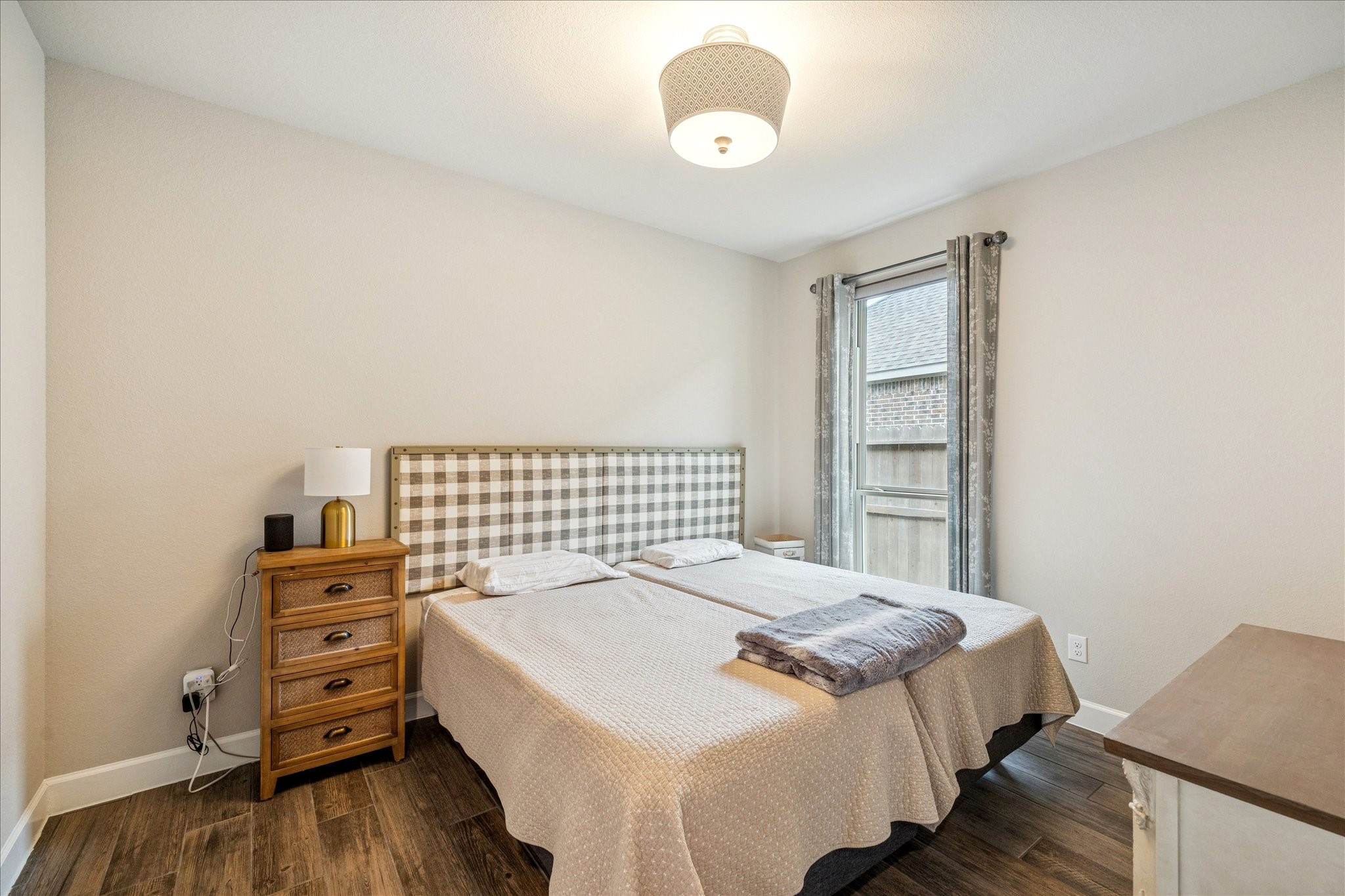 7354 Mount Greylock Loop Porter, TX 77365 - Photo 16 of 18 a bedroom with a bed and wooden floor