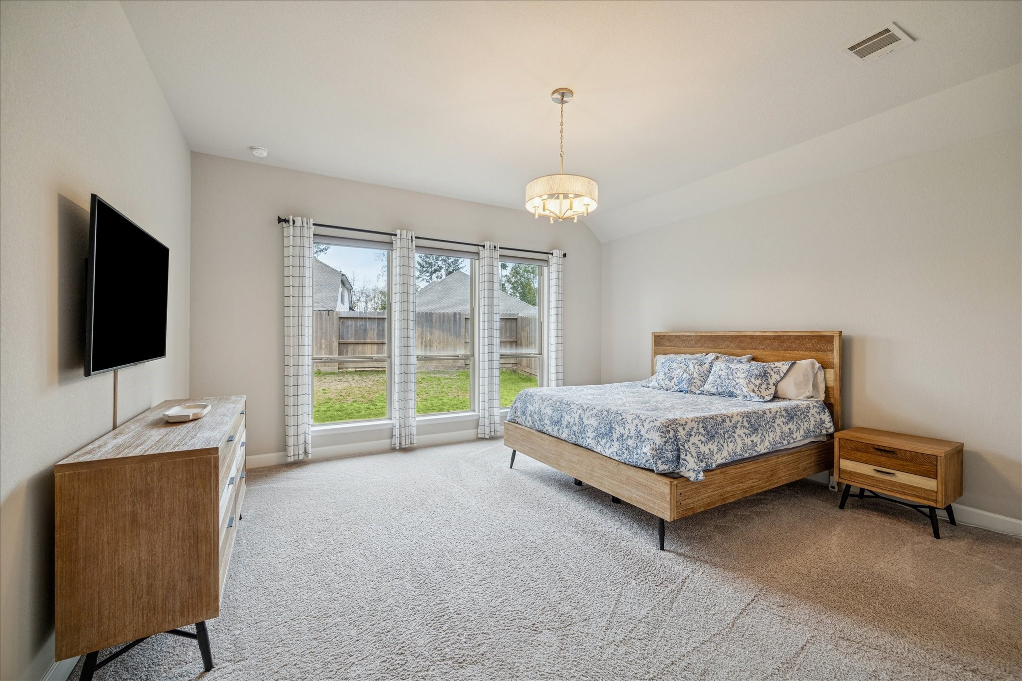 7354 Mount Greylock Loop Porter, TX 77365 - Photo 4 of 18 a bedroom with a bed and glass door