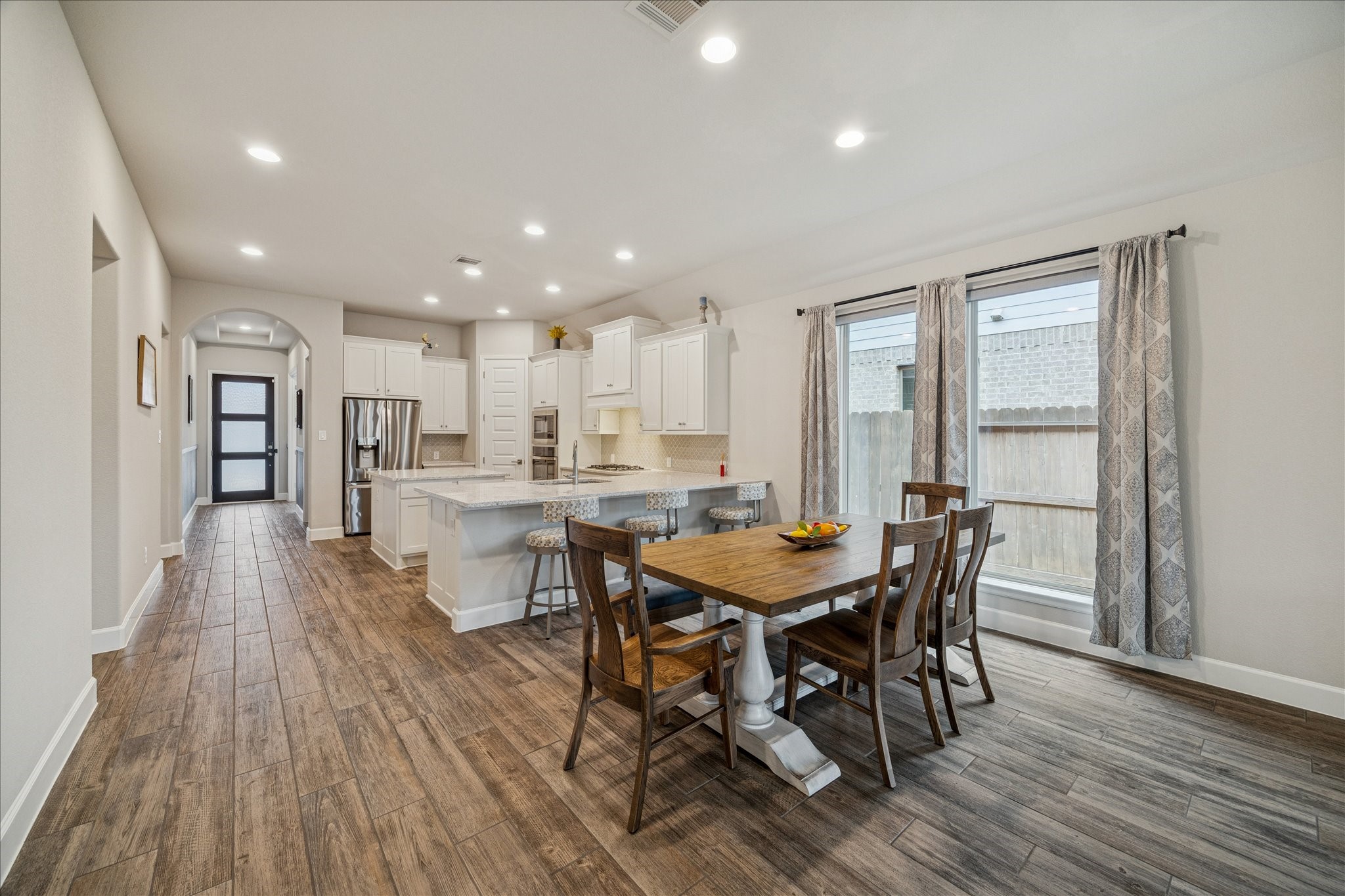 7354 Mount Greylock Loop Porter, TX 77365 - Photo 7 of 18 a view of a dining room with furniture and wooden floor