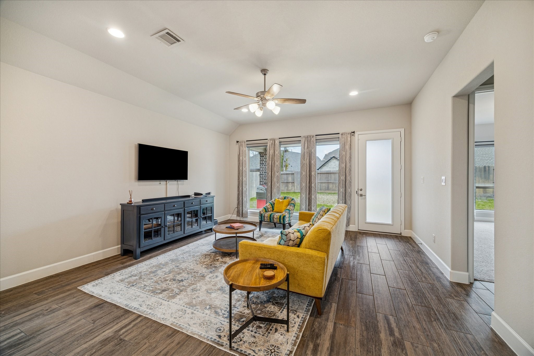 7354 Mount Greylock Loop Porter, TX 77365 - Photo 8 of 18 a living room with furniture and a flat screen tv