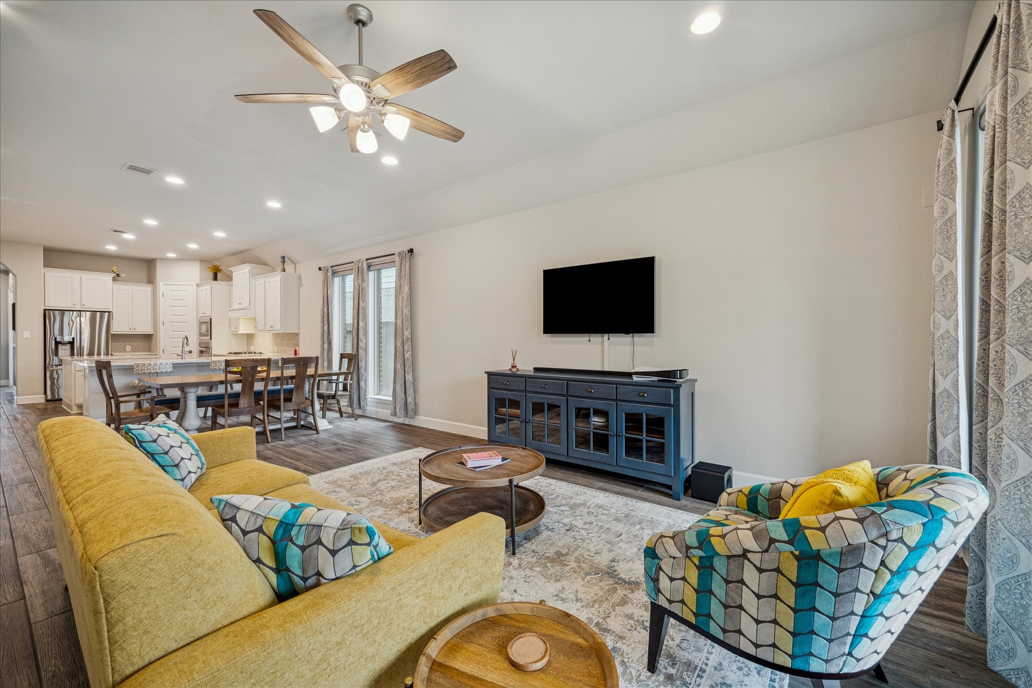 7354 Mount Greylock Loop Porter, TX 77365 - Photo 9 of 18 a living room with furniture a fireplace and a flat screen tv