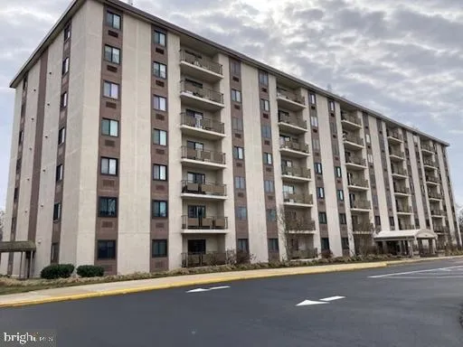 a front view of a building with a street