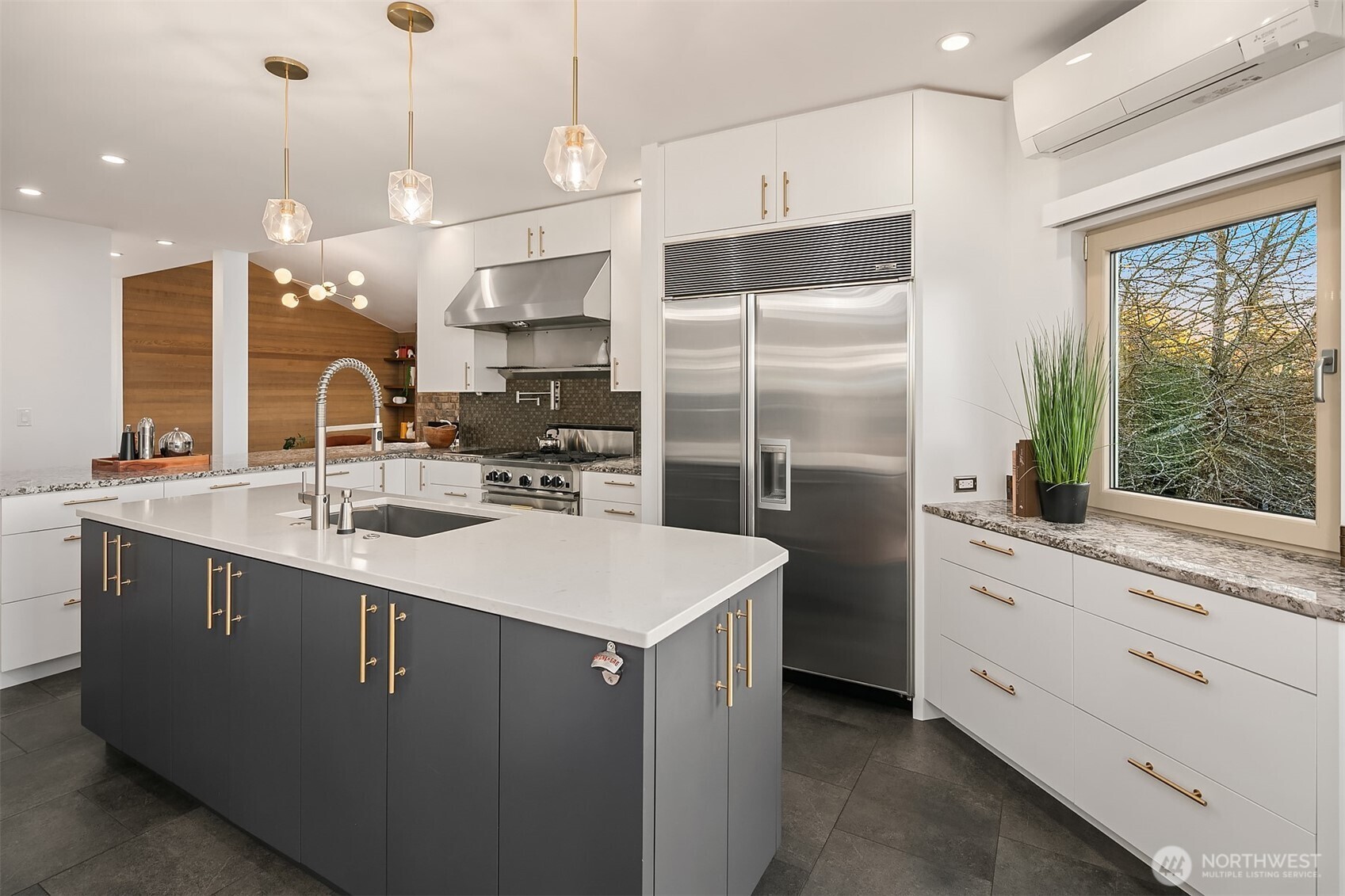 2016 Constance Drive West Seattle, WA 98199 - Photo 12 of 40 a kitchen with stainless steel appliances granite countertop a sink a stove and a refrigerator