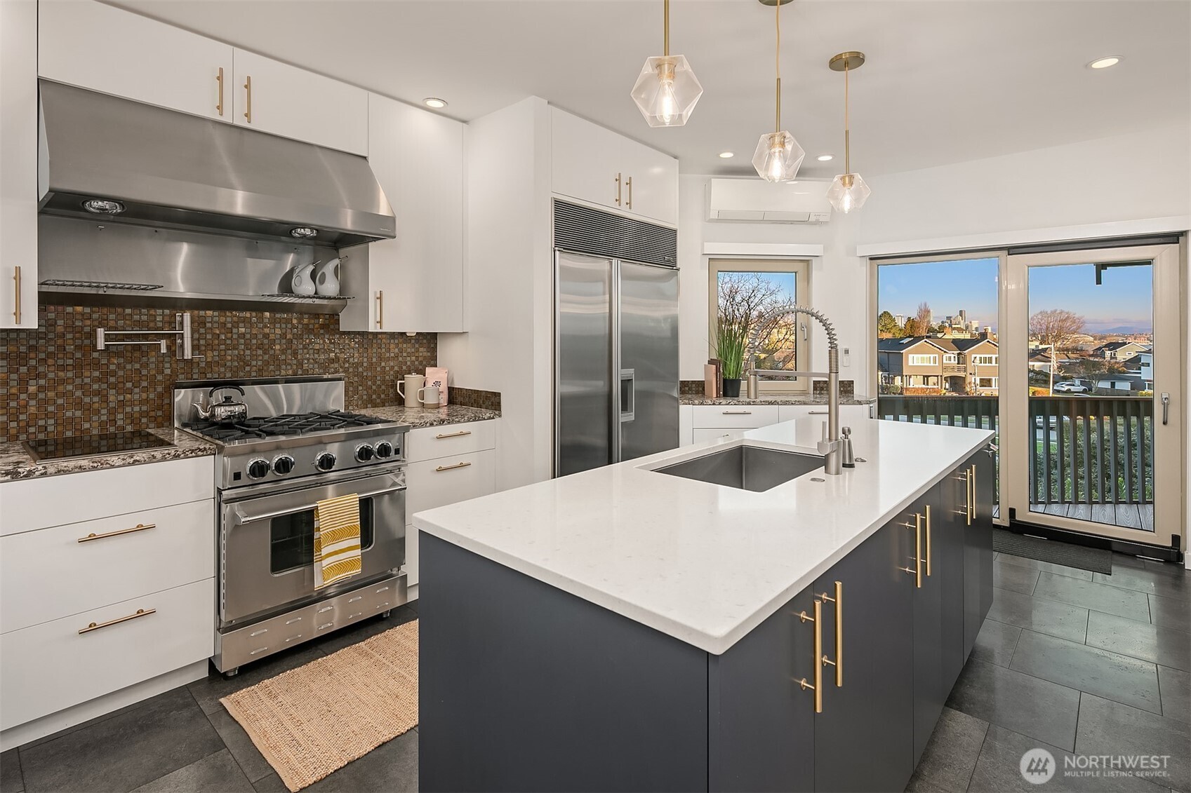 2016 Constance Drive West Seattle, WA 98199 - Photo 13 of 40 a kitchen with a stove a sink and a refrigerator