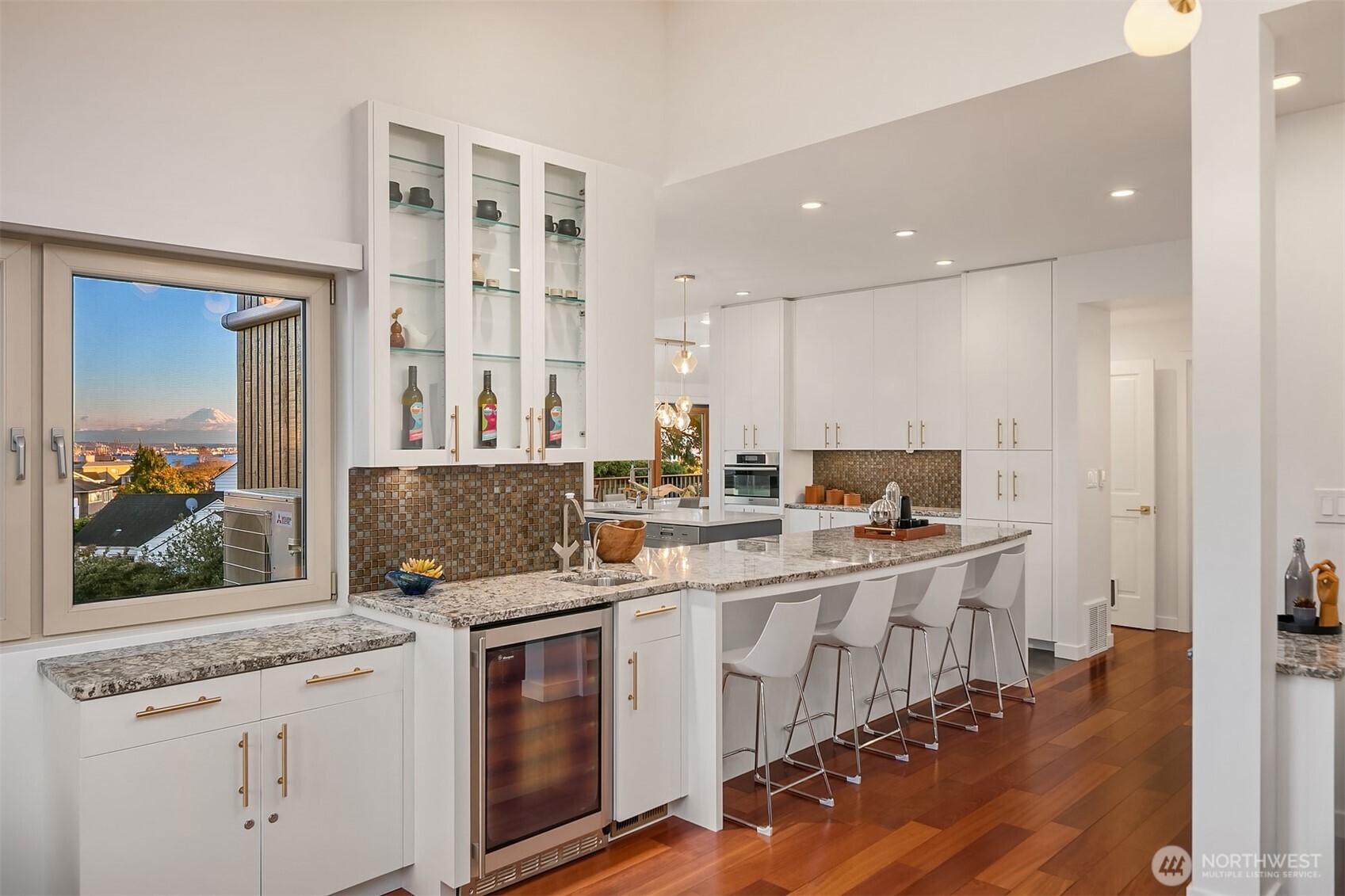 2016 Constance Drive West Seattle, WA 98199 - Photo 14 of 40 a kitchen with a sink stove and cabinets