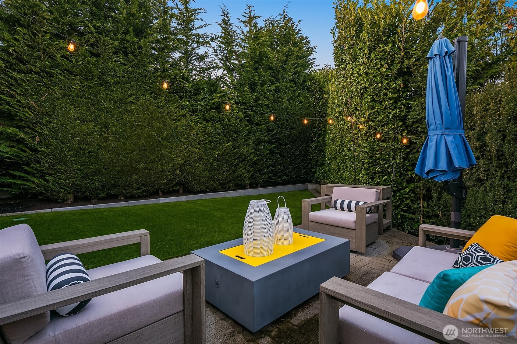 2016 Constance Drive West Seattle, WA 98199 - Photo 17 of 40 an outdoor sitting area with furniture and a garden