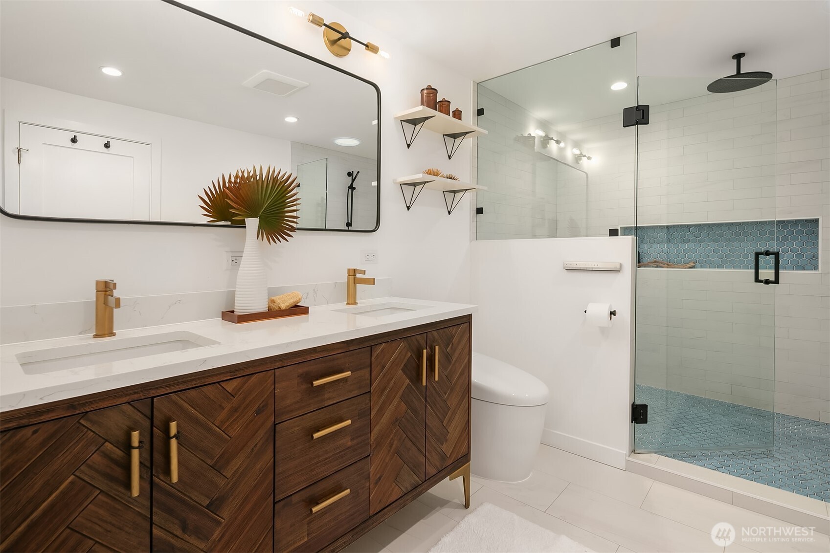 2016 Constance Drive West Seattle, WA 98199 - Photo 22 of 40 a bathroom with a sink a toilet a large mirror and shower