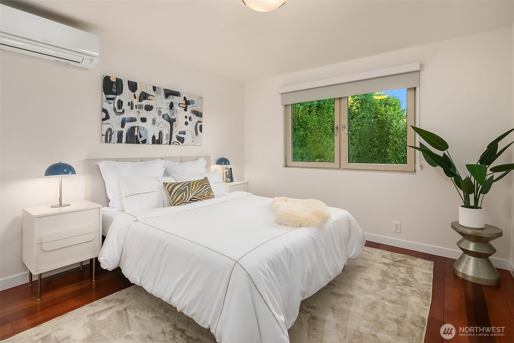 2016 Constance Drive West Seattle, WA 98199 - Photo 24 of 40 a bedroom with a bed and a potted plant