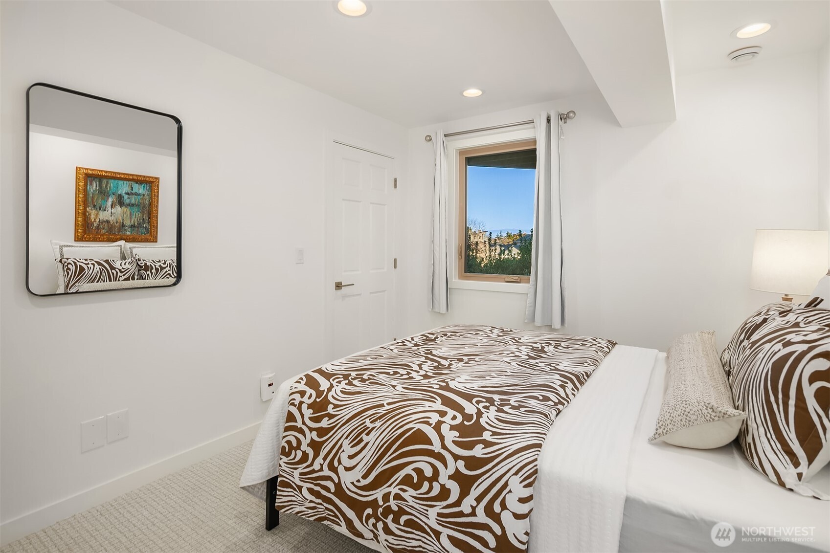 2016 Constance Drive West Seattle, WA 98199 - Photo 36 of 40 a bedroom with a bed and a painting on the wall
