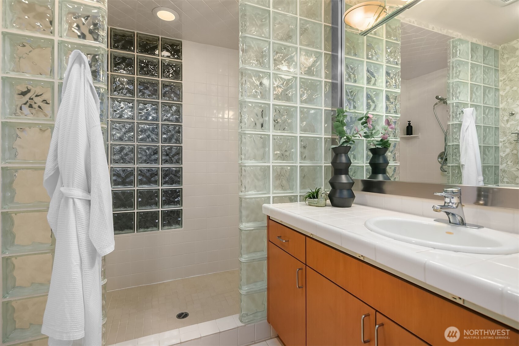 2016 Constance Drive West Seattle, WA 98199 - Photo 37 of 40 a bathroom with a shower and a sink
