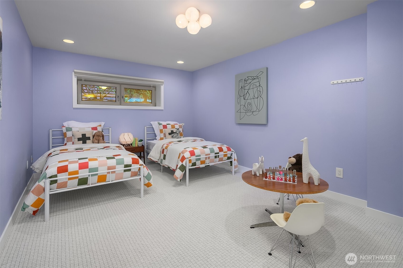 2016 Constance Drive West Seattle, WA 98199 - Photo 39 of 40 a bedroom with two beds and a chair