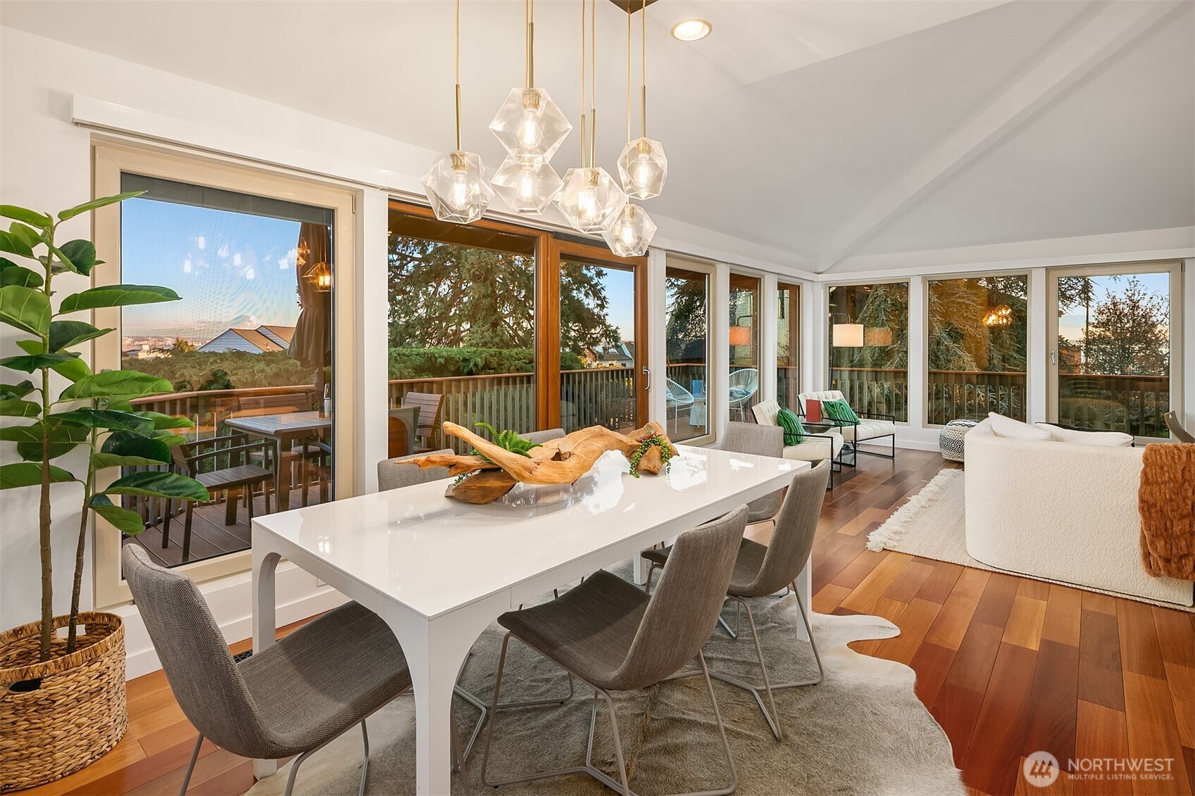 2016 Constance Drive West Seattle, WA 98199 - Photo 8 of 40 a view of a dining room with furniture large windows and wooden floor