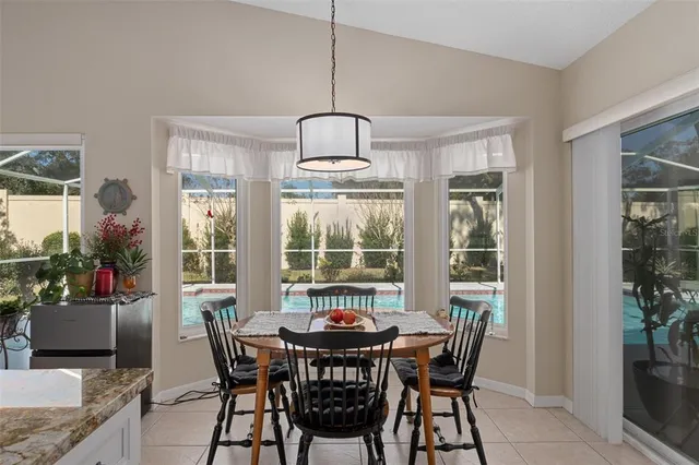 an aerial view of residential houses with outdoor space and river