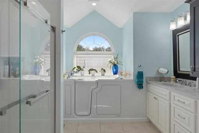 a swimming pool with outdoor seating and yard