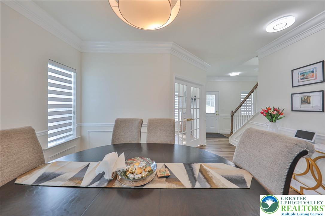 1105 Meco Road Easton, PA 18040 - Photo 20 of 100 Elegant crown molding and classic wainscoting highlight this welcoming dining space.