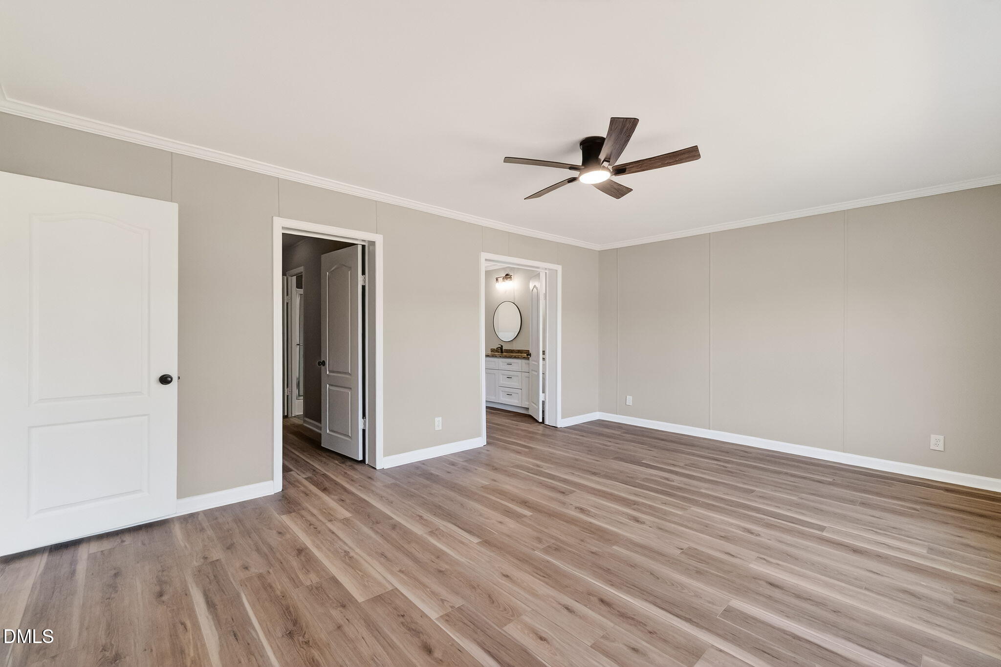 10015 Smith Road Middlesex, NC 27557 - Photo 23 of 48 a view of an empty room with wooden floor and a ceiling fan