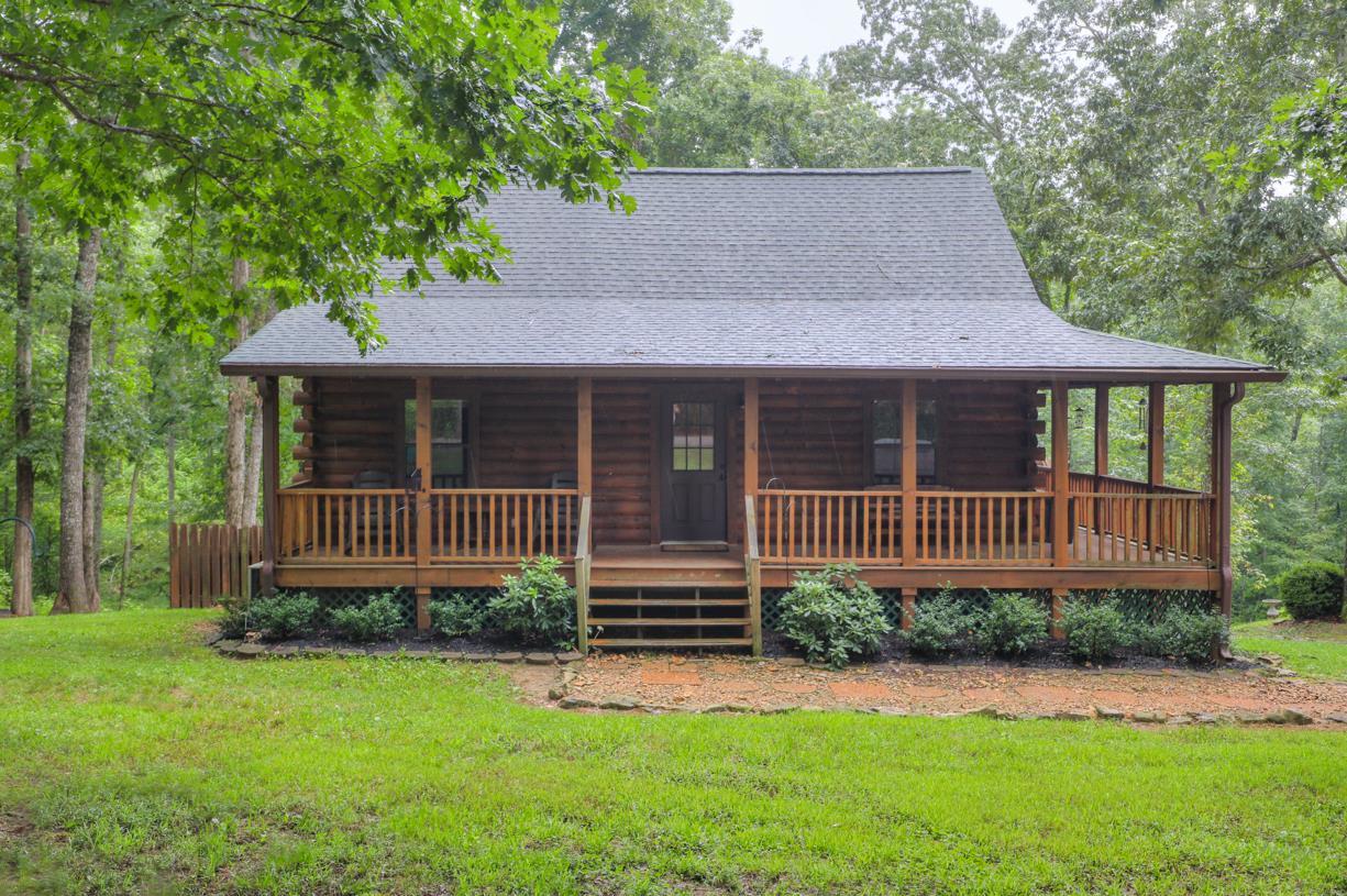 6407 Tom Rail Road Primm Springs, TN 38476 - Photo 1 of 23 a house view with a garden space